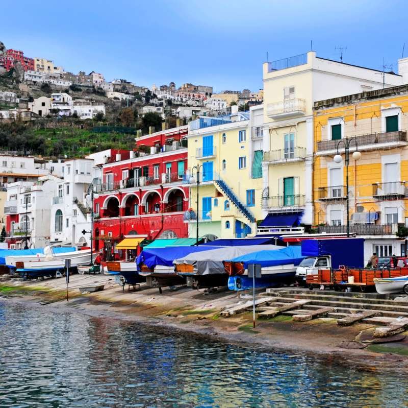 Colorful red, yellow and white houses on the waterfront of Capri