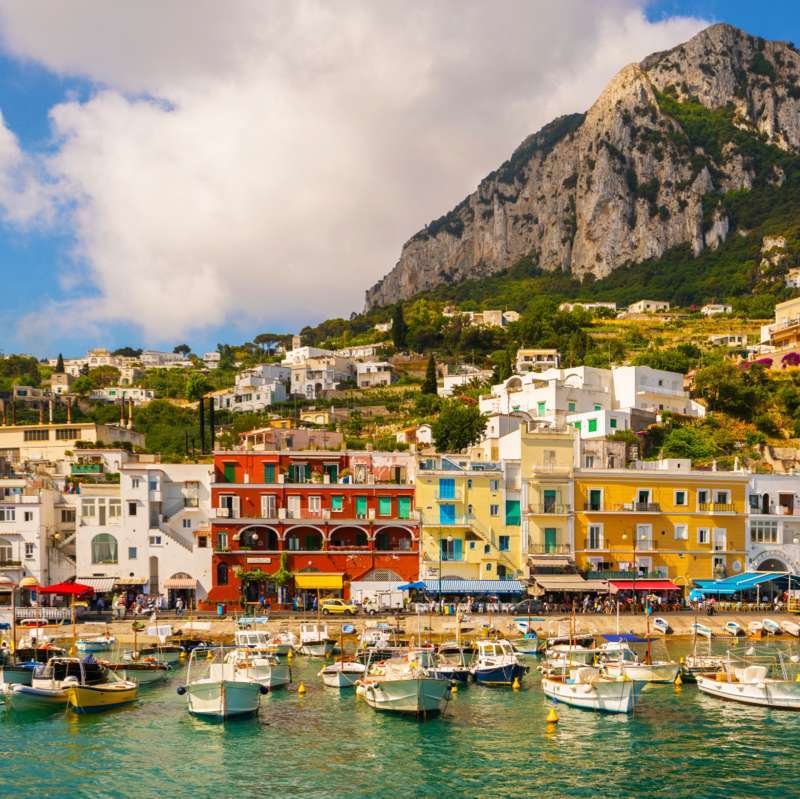 Colorful waterfront houses of Marina Grande in Capri with Monte Solaro behind